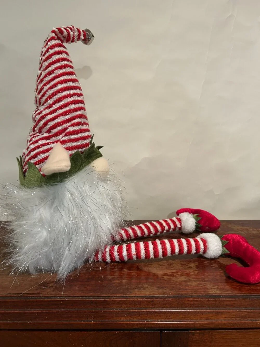 Christmas Holiday Gnome with red and white striped cap and wispy, sparkly white